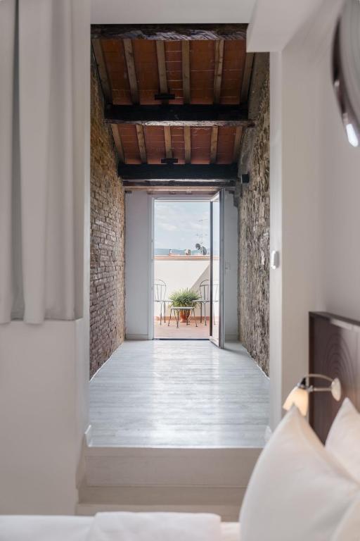 Postel nebo postele na pokoji v ubytování Ruby Bea Hotel Florence