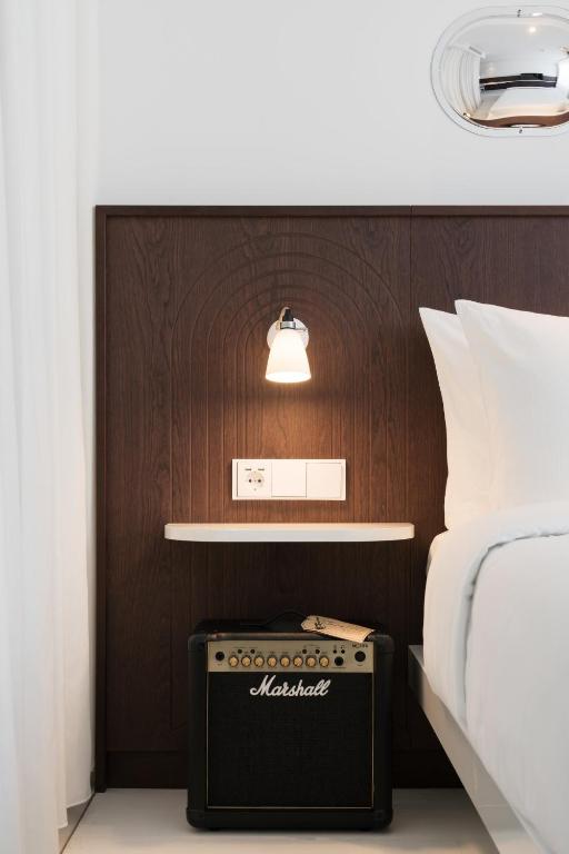 Postel nebo postele na pokoji v ubytování Ruby Bea Hotel Florence