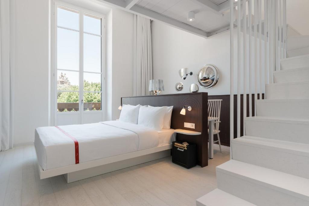 Postel nebo postele na pokoji v ubytování Ruby Bea Hotel Florence
