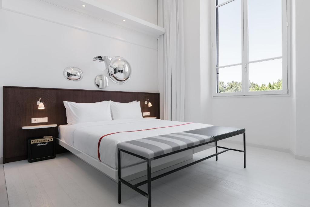 Postel nebo postele na pokoji v ubytování Ruby Bea Hotel Florence