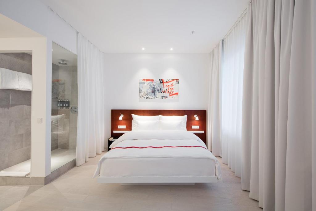 Postel nebo postele na pokoji v ubytování Ruby Marie Hotel Vienna