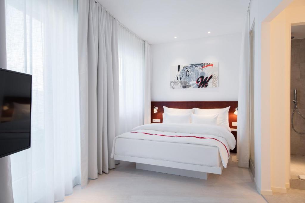 Postel nebo postele na pokoji v ubytování Ruby Marie Hotel Vienna