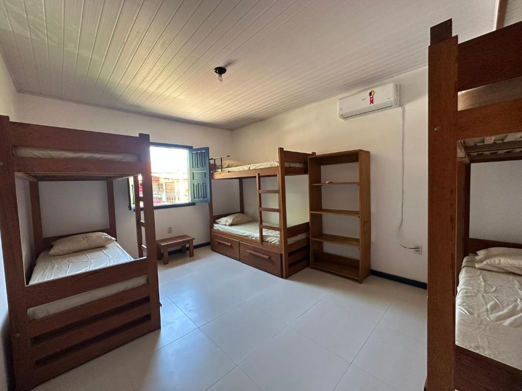 Postel nebo postele na pokoji v ubytování Casa do Mangue Hostel