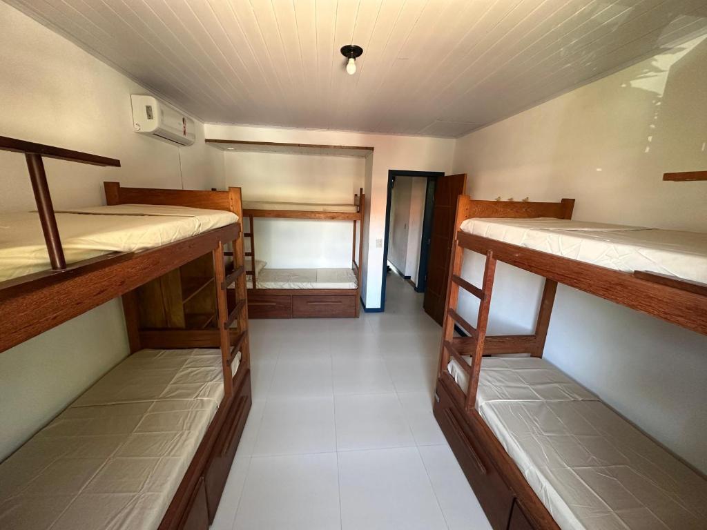 Postel nebo postele na pokoji v ubytování Casa do Mangue Hostel