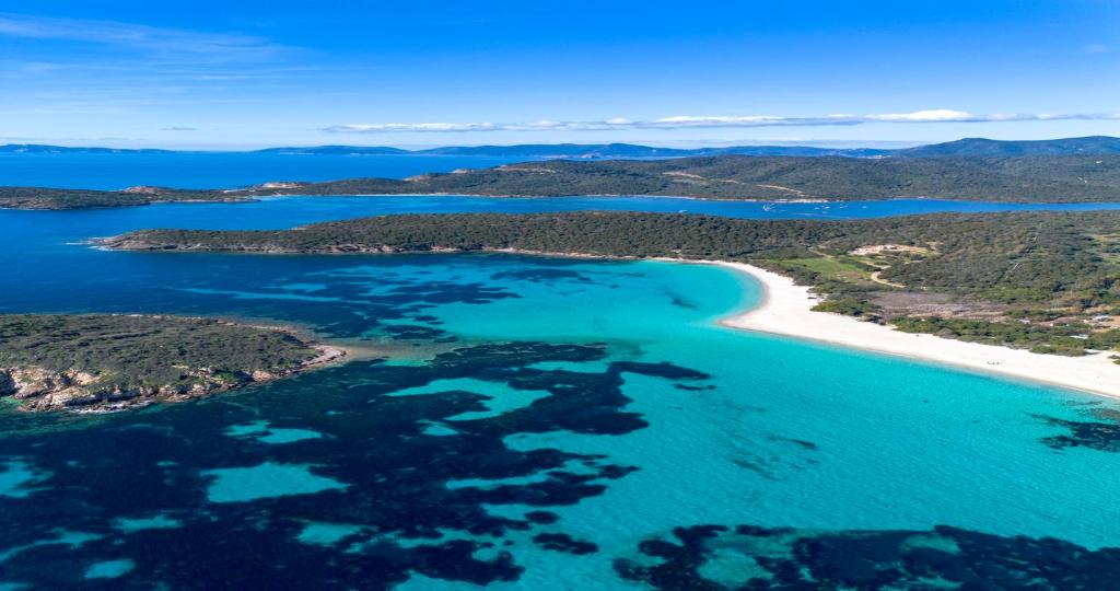 an aerial view of a beach in the ocean at President Villa Tuerredda in Chia