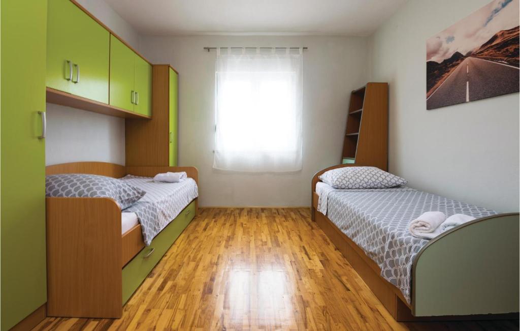 Posteľ alebo postele v izbe v ubytovaní Two-Bedroom Holiday Home In Krusevo