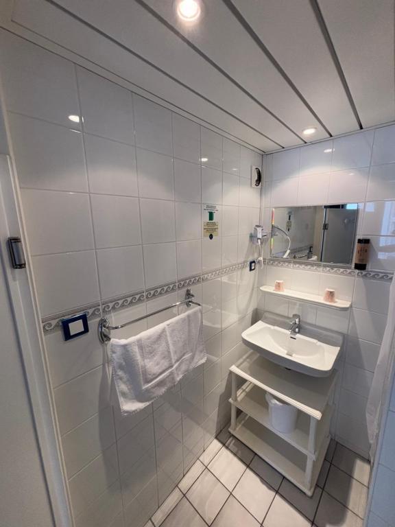 Koupelna v ubytování Hotel le Taillon