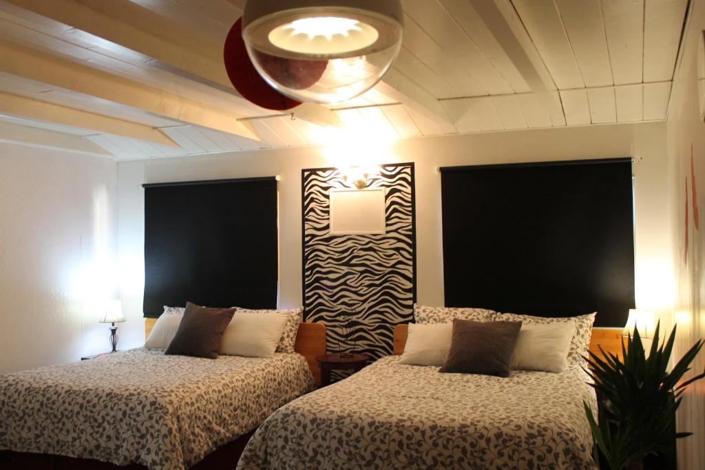 Postel nebo postele na pokoji v ubytování Sage Hills Motel