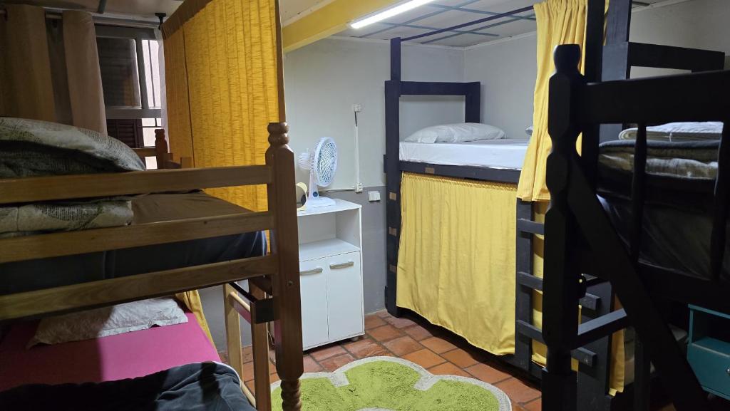 Postel nebo postele na pokoji v ubytování Gramado Guest House