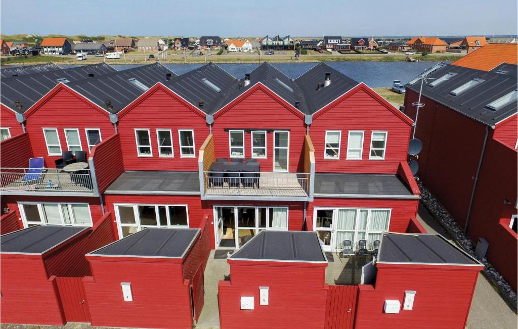 an aerial view of red houses in a harbor at Holiday Home Havnevej Ulfborg Ix in Thorsminde