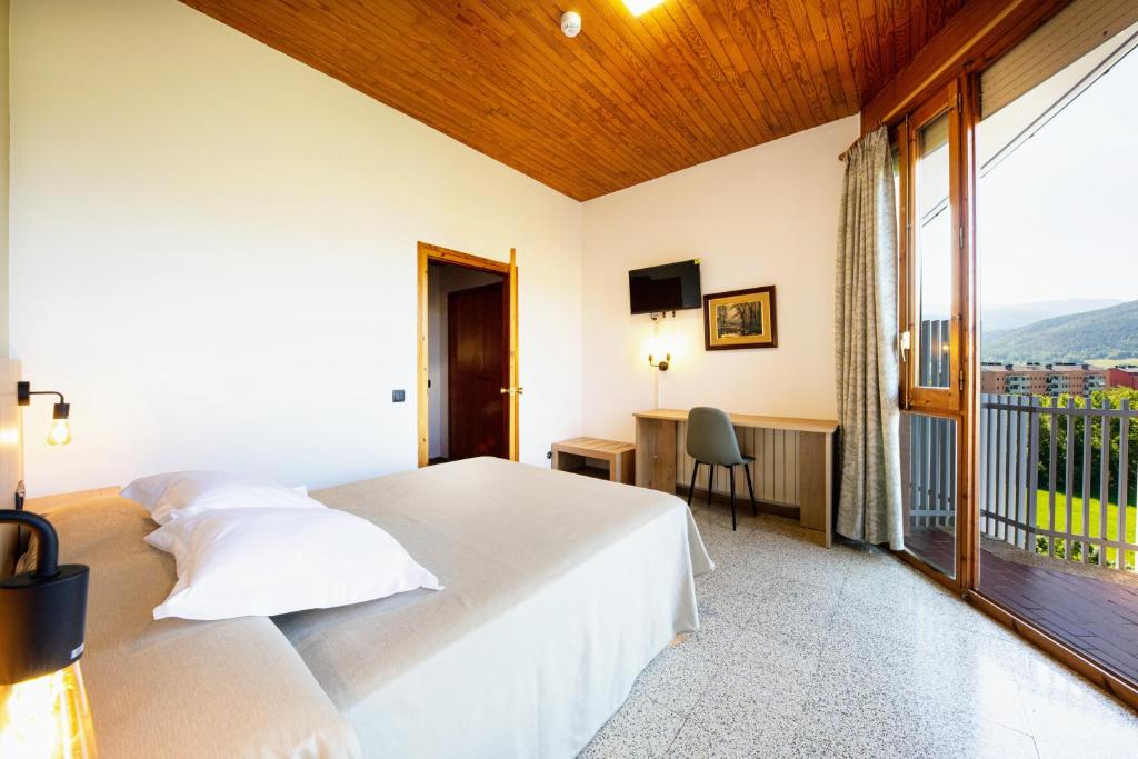 Postel nebo postele na pokoji v ubytování Hotel Restaurante La Glorieta