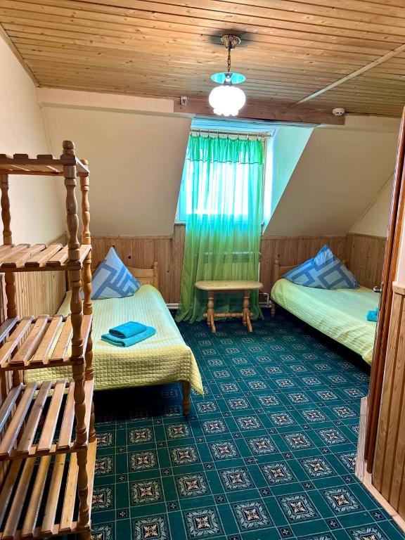 Postel nebo postele na pokoji v ubytování Хата Магната та Смерекова Хата