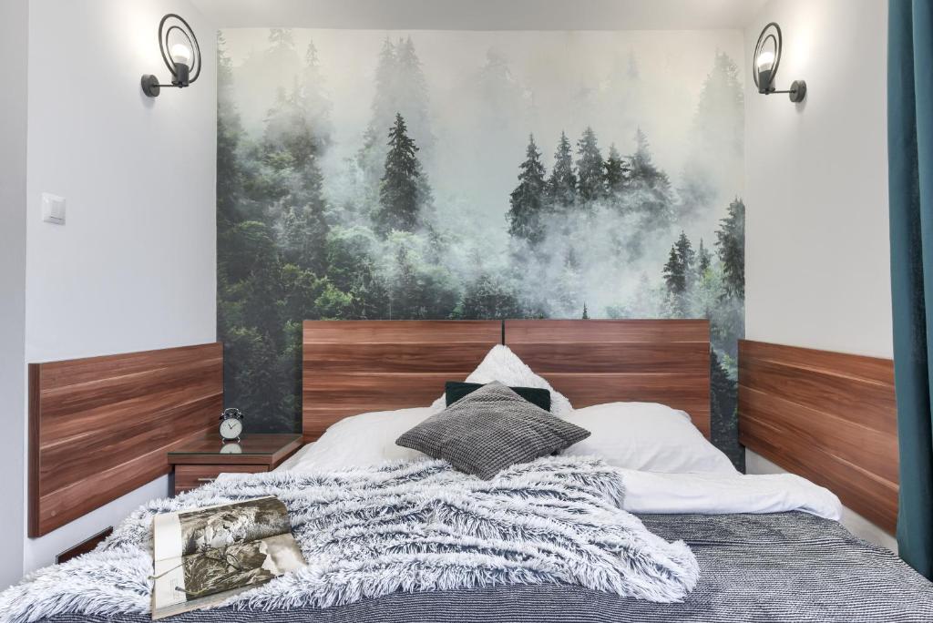 Posteľ alebo postele v izbe v ubytovaní Przytulia Apartamenty i Pokoje