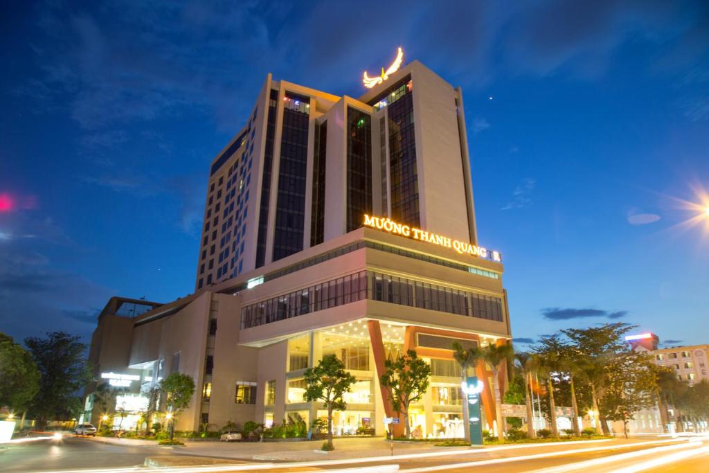 a building with a sign on top of it at Muong Thanh Grand Quang Tri Hotel in Quang Tri