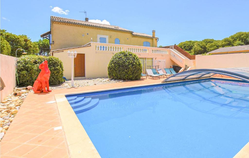 a large swimming pool in front of a house at Lovely Home In Saint-Maurice-Sur-Eygu in Saint-Maurice-sur-Eygues