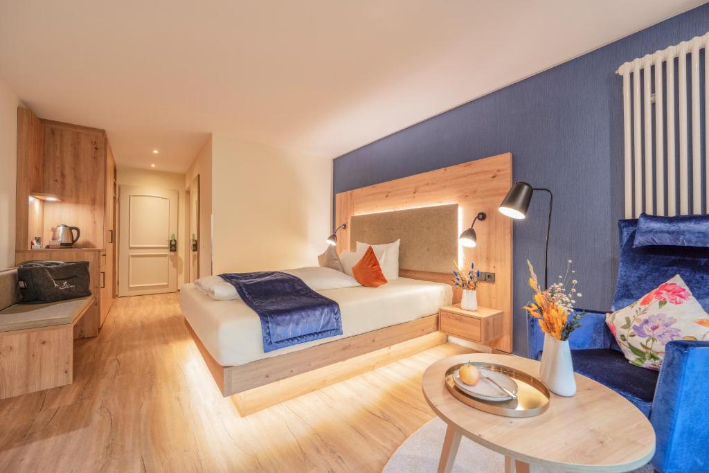 Postel nebo postele na pokoji v ubytování Hotel Langenwaldsee