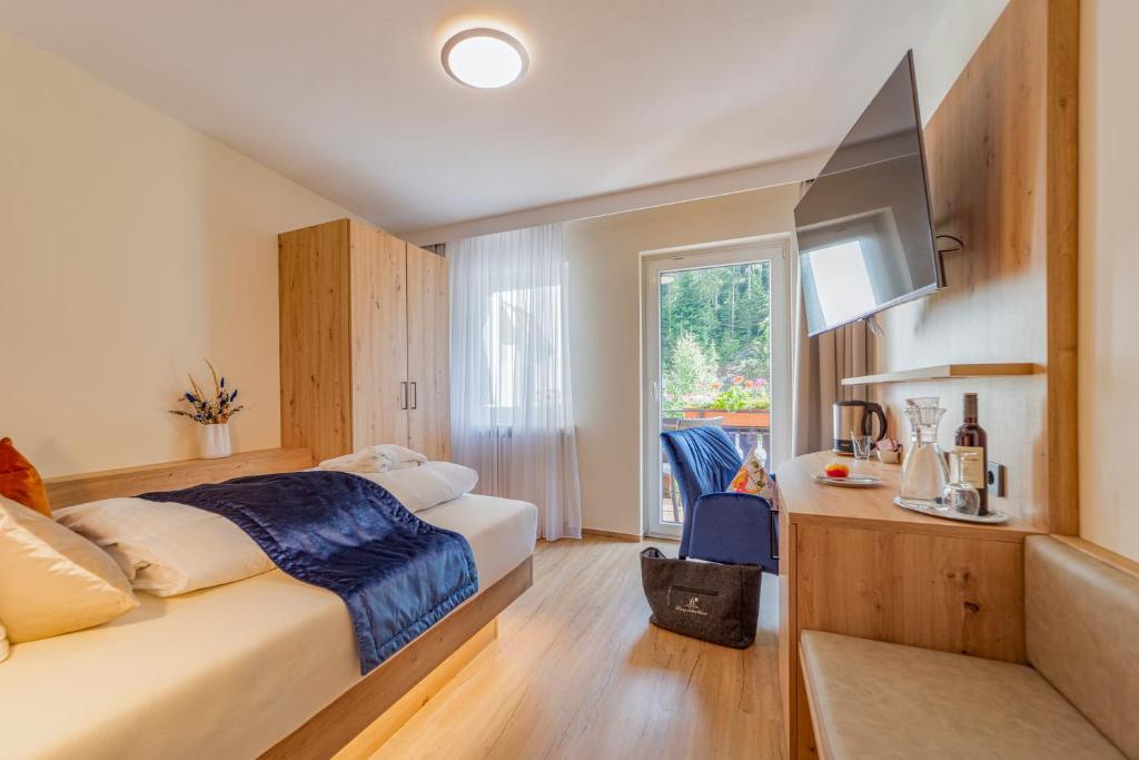 Postel nebo postele na pokoji v ubytování Hotel Langenwaldsee