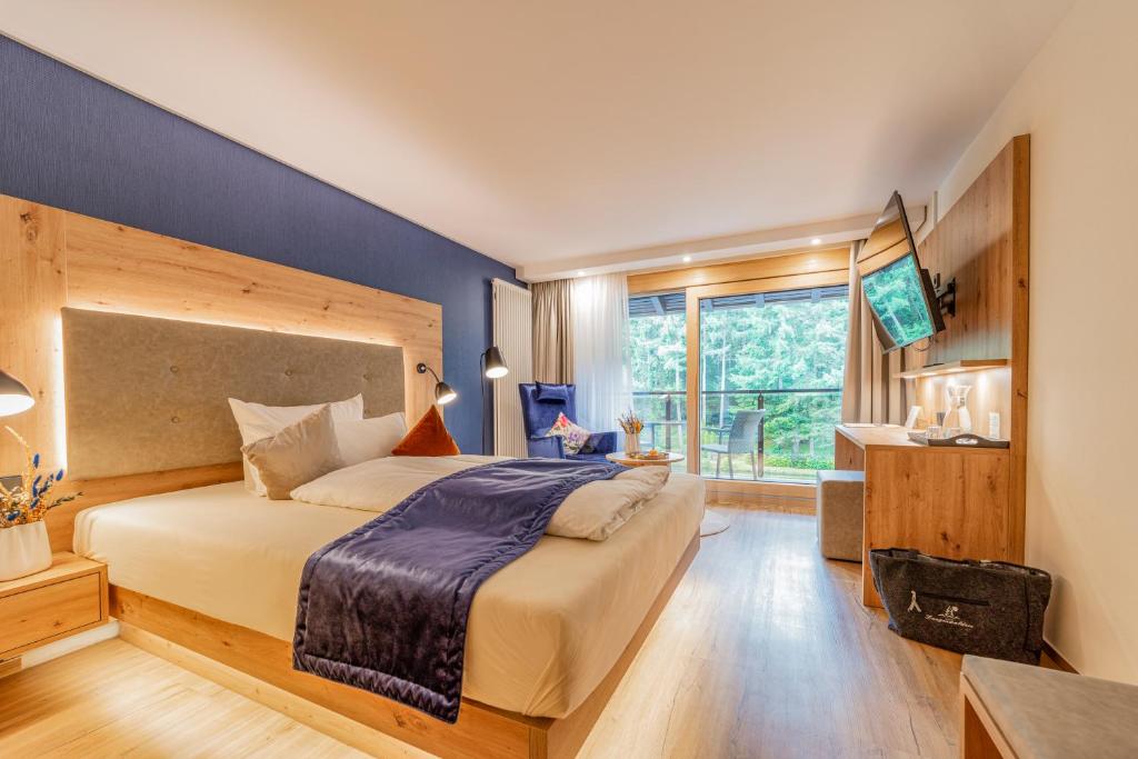 Postel nebo postele na pokoji v ubytování Hotel Langenwaldsee