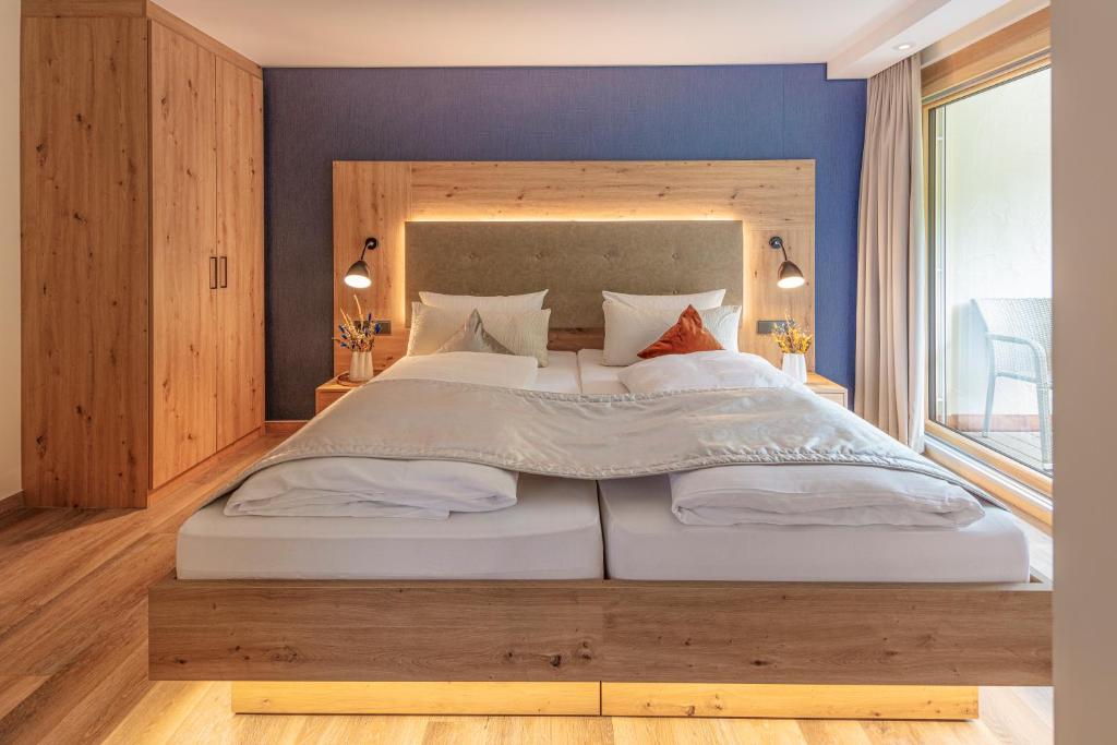 Postel nebo postele na pokoji v ubytování Hotel Langenwaldsee