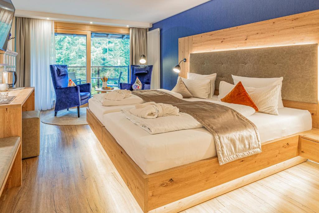 Postel nebo postele na pokoji v ubytování Hotel Langenwaldsee