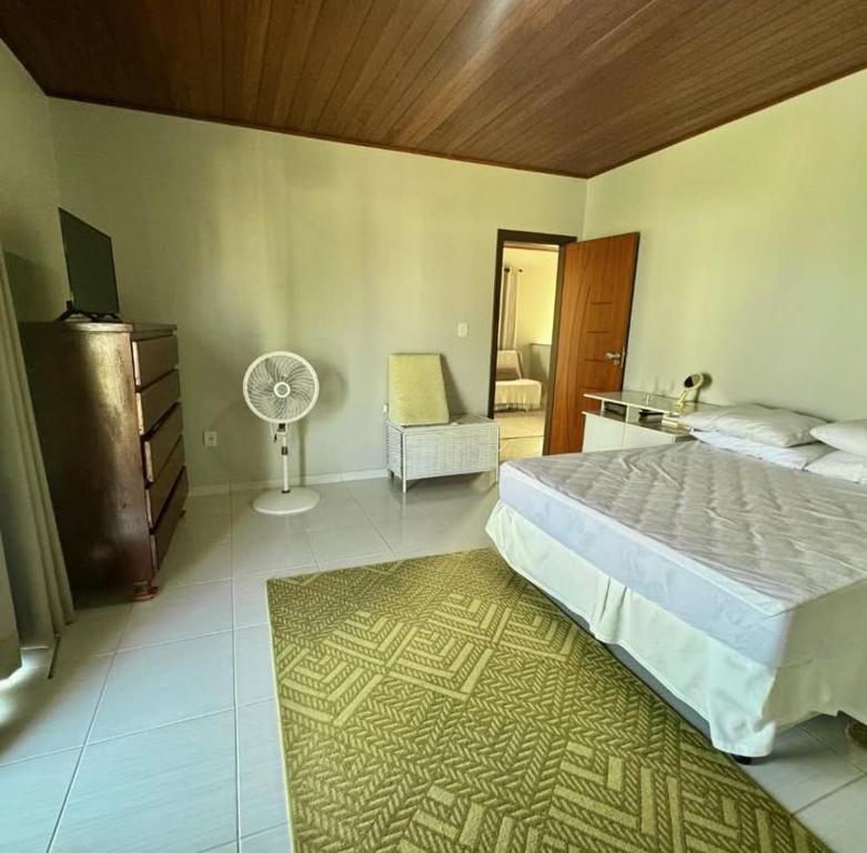 Ένα ή περισσότερα κρεβάτια σε δωμάτιο στο Linda Casa Na Barro Do Jacúipe