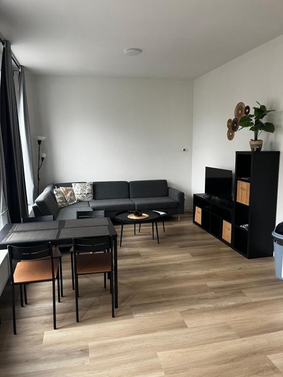 TV o dispositivi per l'intrattenimento presso Apartement hotel Stays by ADM