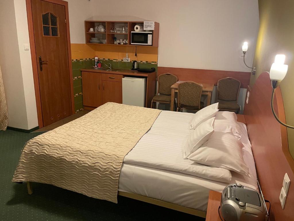 Postel nebo postele na pokoji v ubytování Willa Stenia Apartamenty