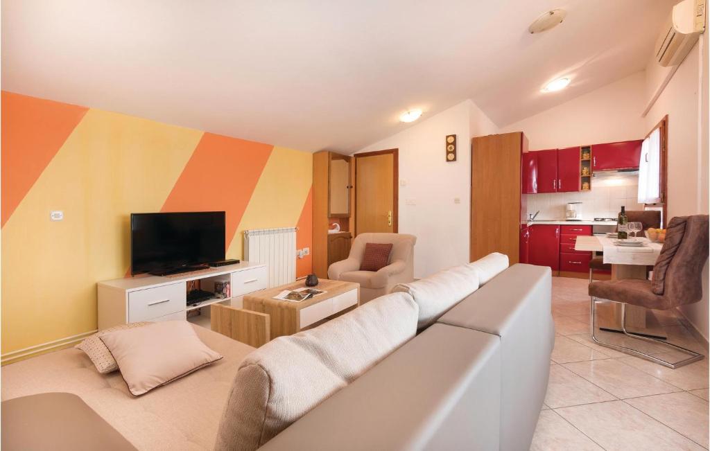 Telewizja i/lub zestaw kina domowego w obiekcie Lovely Home In Vodnjan