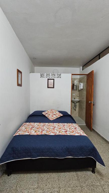Postel nebo postele na pokoji v ubytování Hospedaje Santa Teresita