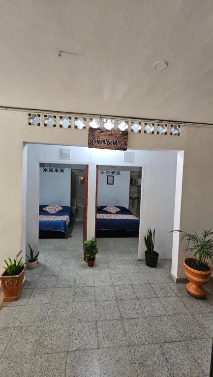 Postel nebo postele na pokoji v ubytování Hospedaje Santa Teresita