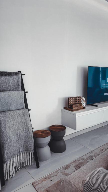 TV a/nebo společenská místnost v ubytování Rumays House, Barka