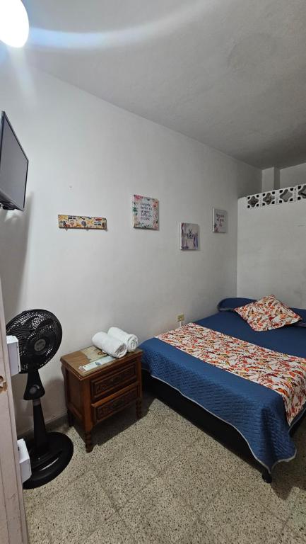 Postel nebo postele na pokoji v ubytování Hospedaje Santa Teresita