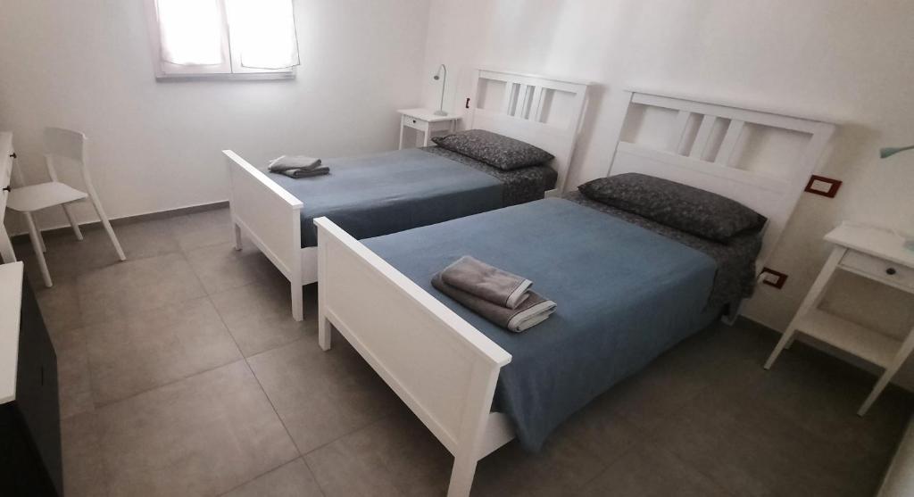 Postel nebo postele na pokoji v ubytování Al Cortile Tranquillo