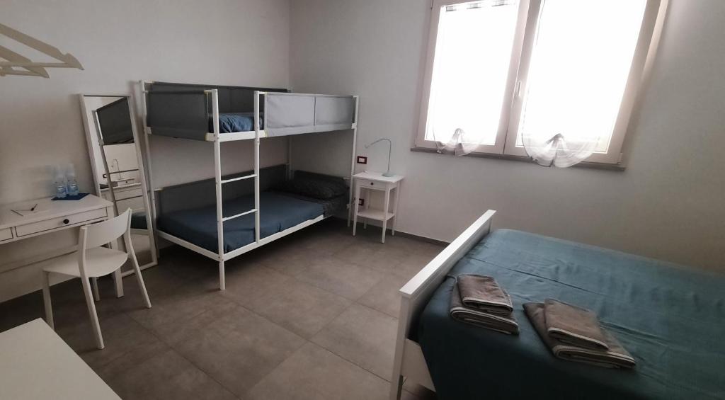 Postel nebo postele na pokoji v ubytování Al Cortile Tranquillo