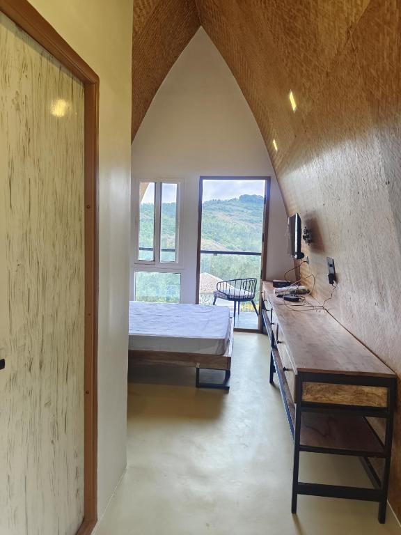 Voodi või voodid majutusasutuse Gambhiraa Resorts toas