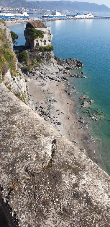 a view of a rocky shoreline with the ocean at B&B DieMme Amalfi Coast in Vietri sul Mare