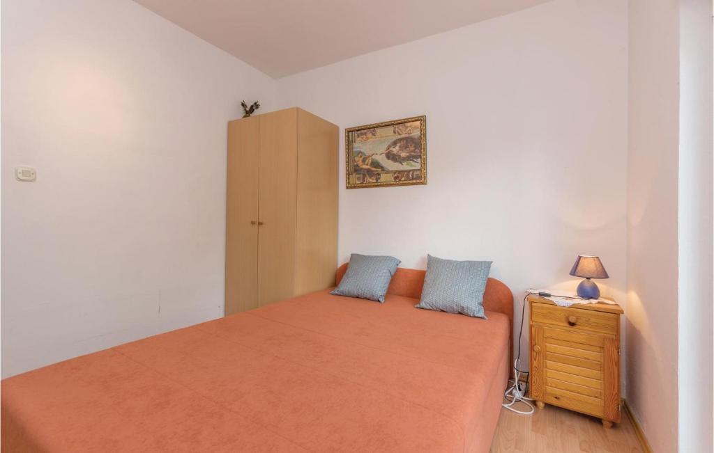 Postel nebo postele na pokoji v ubytování Apartment Donji Karin 11