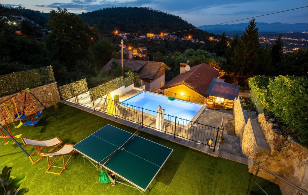 an aerial view of a house with a tennis court at 4 Bedroom Beautiful Home In Rukavac in Rukavac