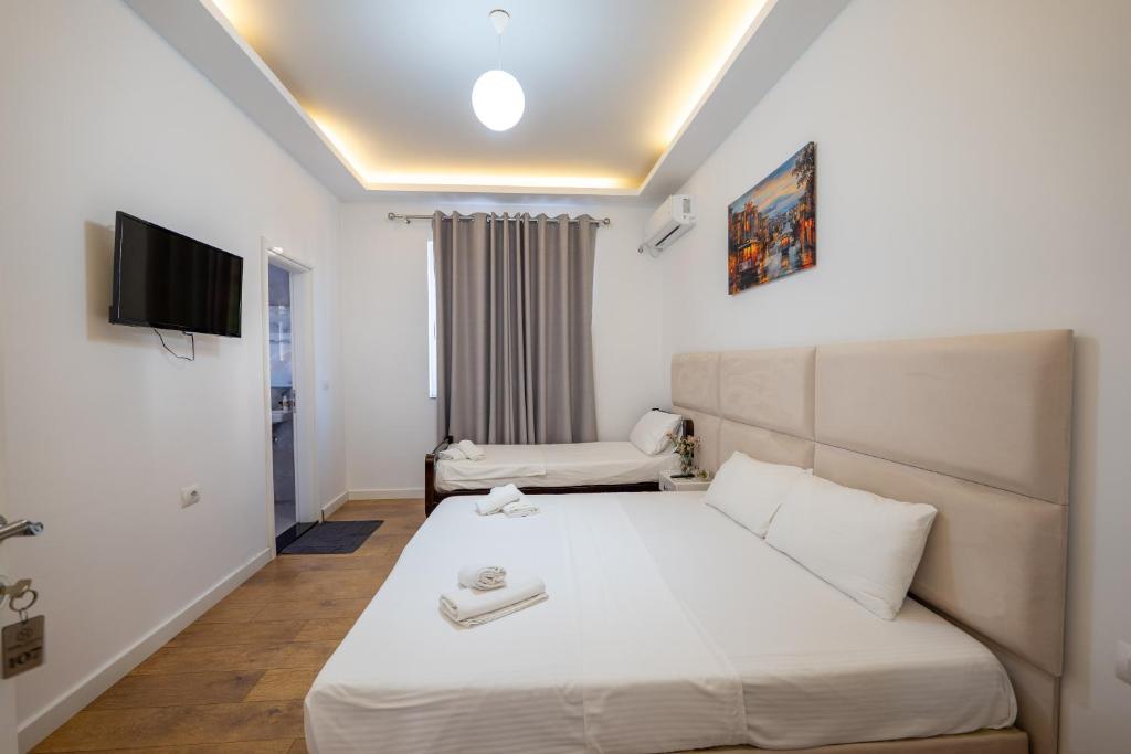 Postel nebo postele na pokoji v ubytování Hotel Myrtai - City Center