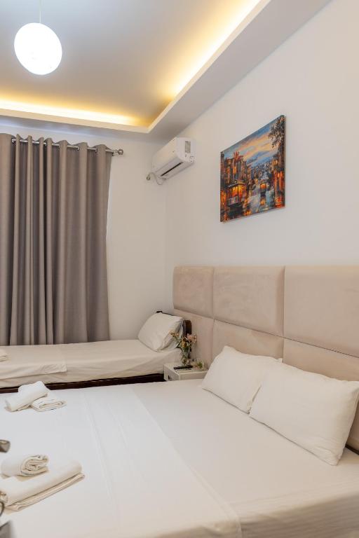 Postel nebo postele na pokoji v ubytování Hotel Myrtai - City Center