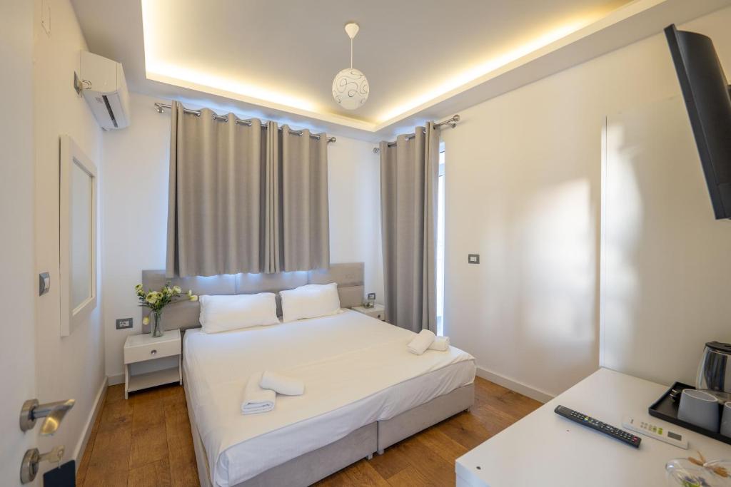 Postel nebo postele na pokoji v ubytování Hotel Myrtai - City Center