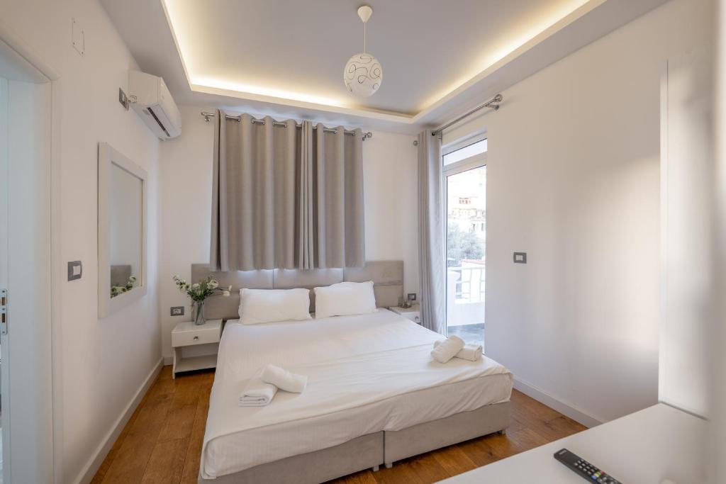 Postel nebo postele na pokoji v ubytování Hotel Myrtai - City Center