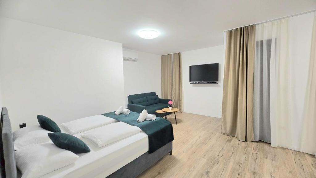 Postel nebo postele na pokoji v ubytování Hotel MM Residence