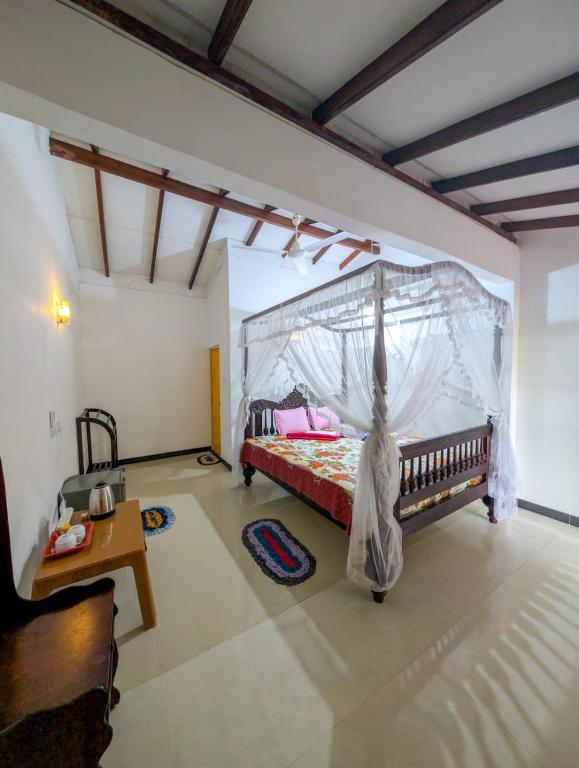 Postel nebo postele na pokoji v ubytování Samudra Guest House