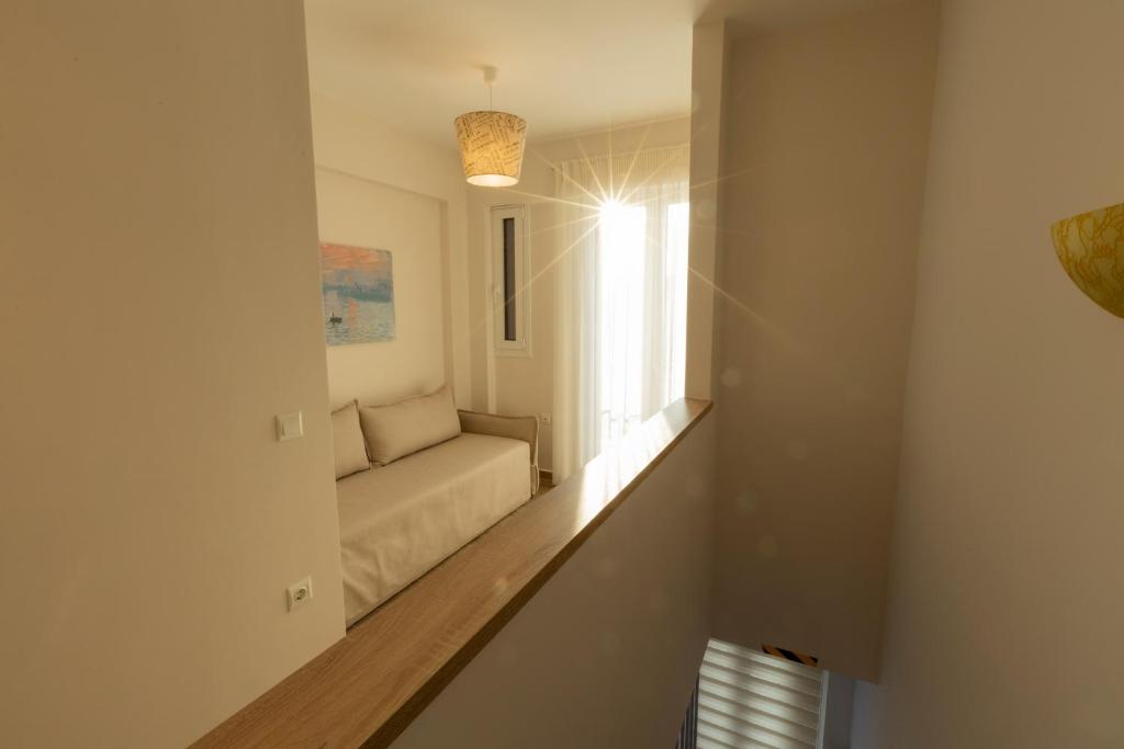 Postel nebo postele na pokoji v ubytování Halcyon Days Maisonettes Nafpaktos