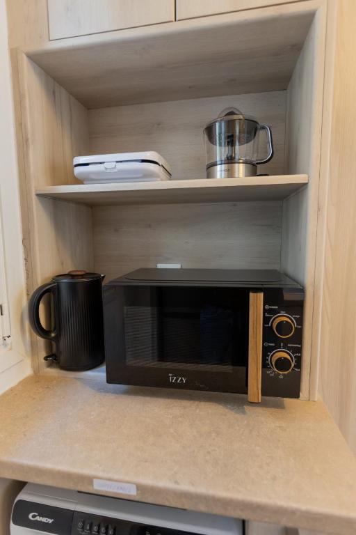 Kuchyň nebo kuchyňský kout v ubytování Halcyon Days Maisonettes Nafpaktos