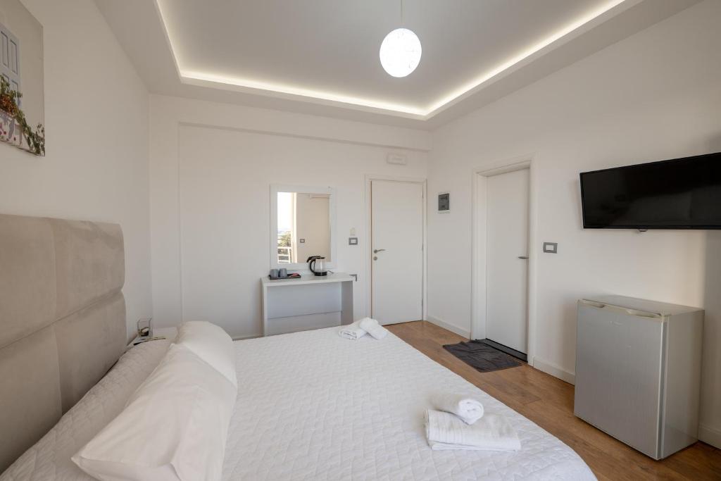 Postel nebo postele na pokoji v ubytování Hotel Myrtai - City Center
