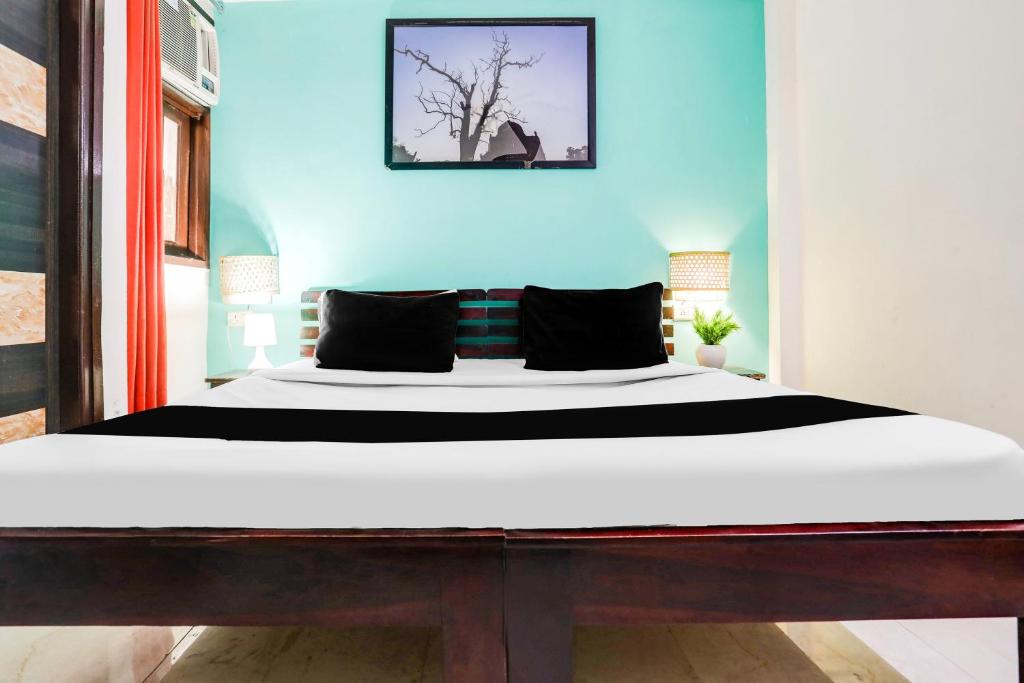Postel nebo postele na pokoji v ubytování Hotel O KD Plaza 6