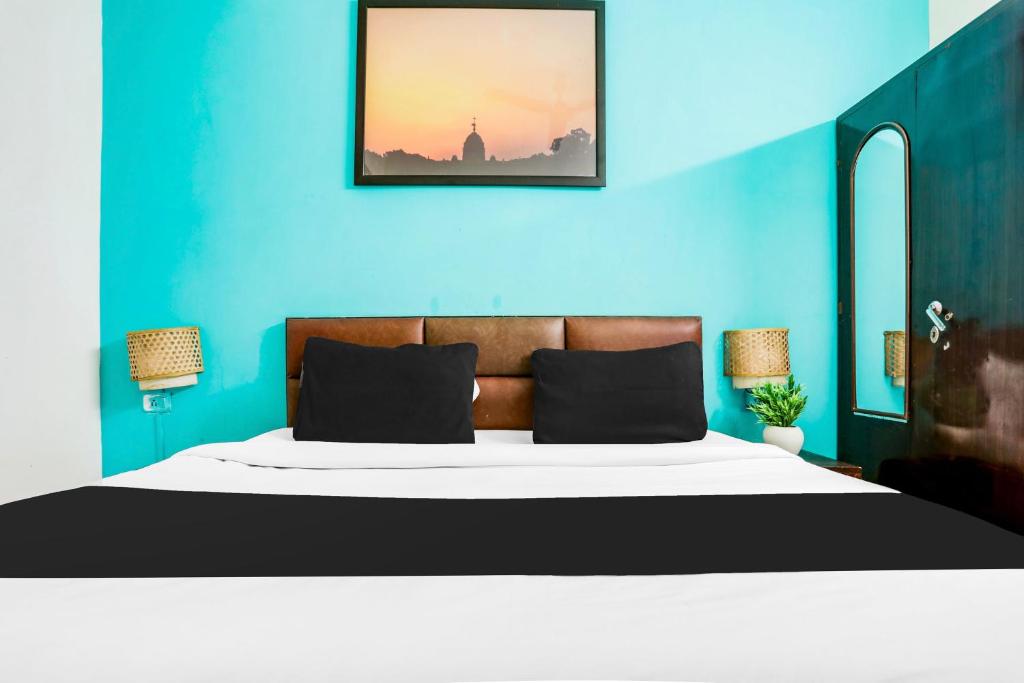 Postel nebo postele na pokoji v ubytování Hotel O KD Plaza 6