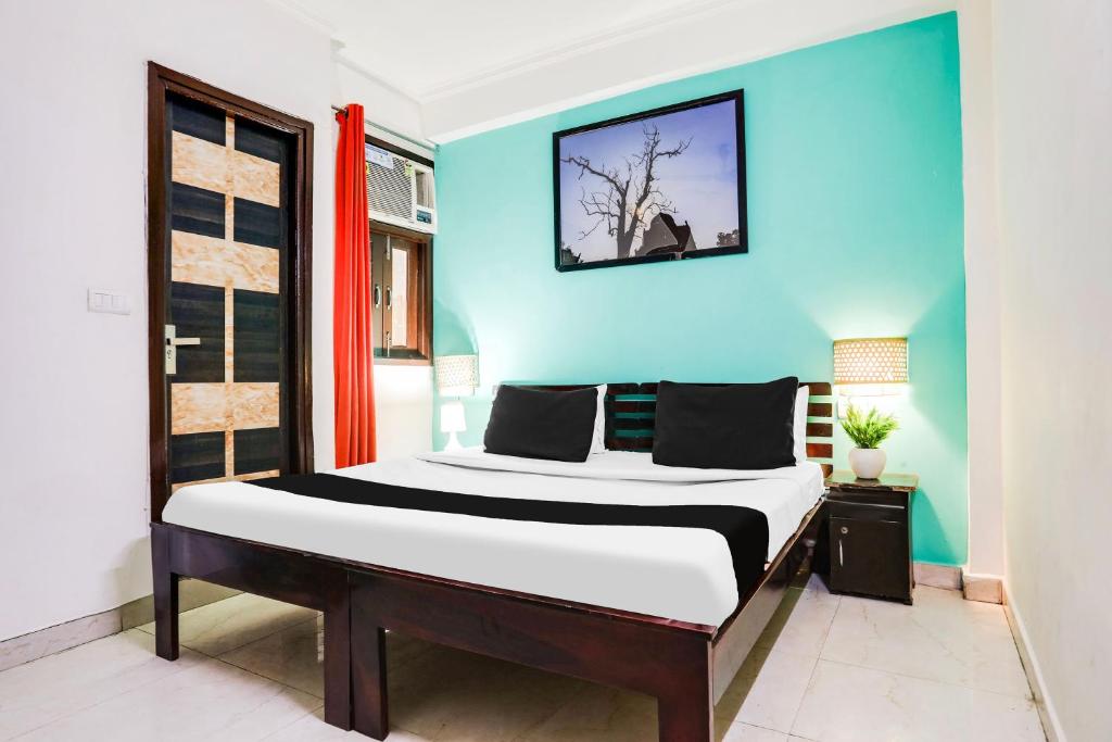 Postel nebo postele na pokoji v ubytování Hotel O KD Plaza 6